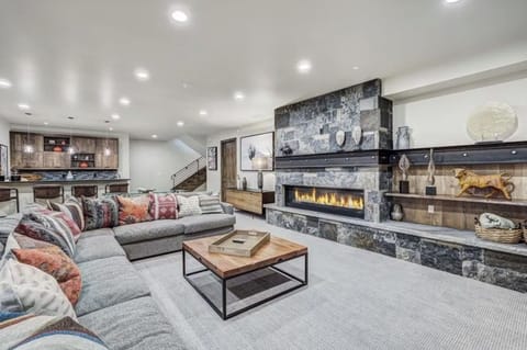 Lower-Level Lounge — a sophisticated rec space with gas fireplace, Smart TV, Sonos, and a sprawling sectional — the perfect hub for relaxing or entertaining. 🍷🔥
