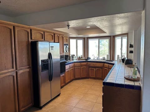 The kitchen is equipped with an icemaker and filtered water from the fridge, and there's a dishwasher so you can have a true vacation