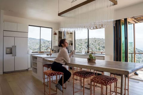 Beautiful, custom chandelier over dining island