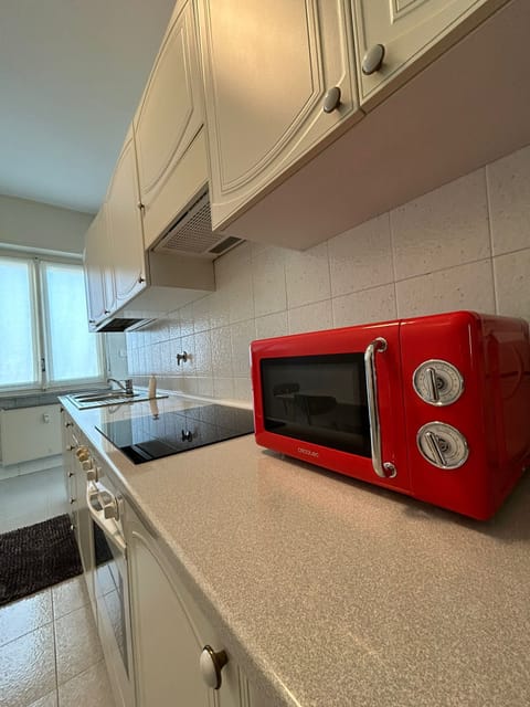 Deluxe Condo | Private kitchen | Full-size fridge, microwave, oven, espresso maker