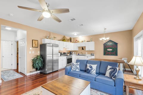 Living Room w/ Sofa Bed & Kitchen