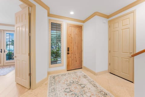 Entry way with garage and first bedroom access