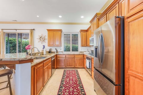 Kitchen features stainless steel appliances and basic essentials