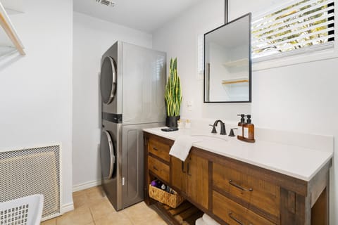 New stackable washer and dryer for your use in the laundry room bathroom.