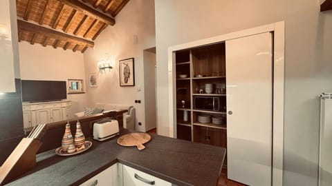 Interior Design, Flooring, Furniture, Wood, Ceiling, Countertop, Cabinetry, Kitchen, Floor, Lighting