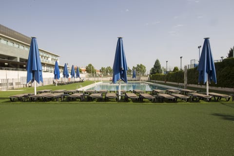 Outdoor pool, open 11:00 AM to 8:00 PM, pool umbrellas, sun loungers