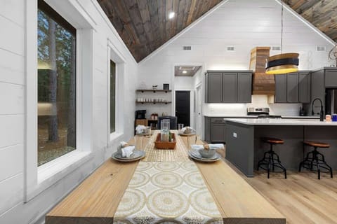 Open dining area beside the kitchen, perfect for family meals and cabin gatherings.