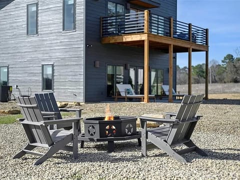 Cozy firepit with modern seating, unwind under the stars right outside your cabin getaway