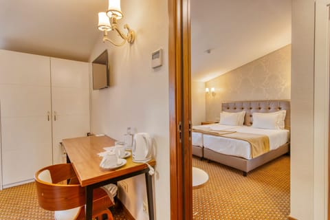 Deluxe Room, 2 Bedrooms | Minibar, in-room safe, desk, soundproofing