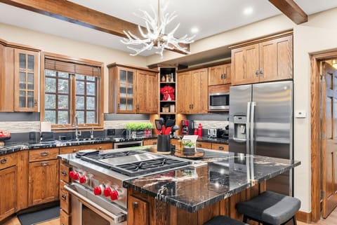 Kitchen: Drip coffee maker, Crockpot, blender, toaster, cooking utensils, tableware