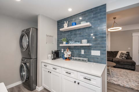 The chic, open kitchen offers ample space & all the comforts of home​