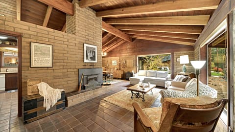 Cozy living room will large windows to take in the beauty of the nature