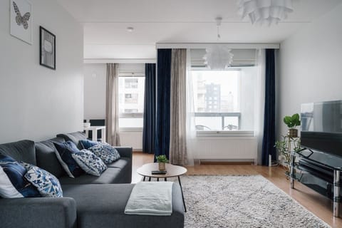 The bright and open living room is the perfect place to gather and relax.