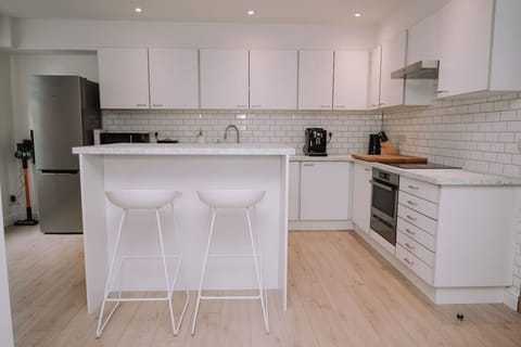 Kitchen with hair chairs and modern facilities