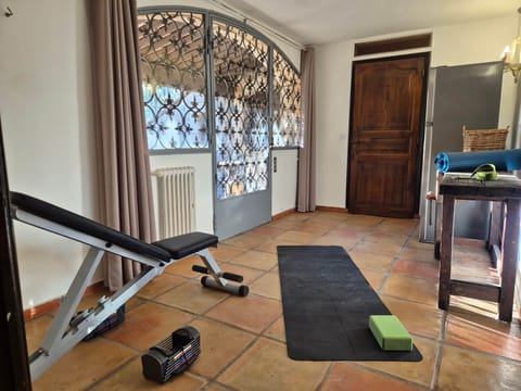 Simple gym with yoga mates and workout bench  / weights