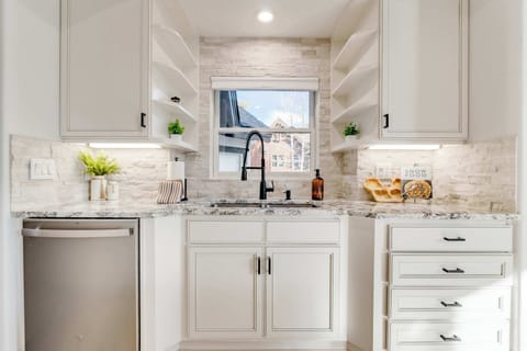 Primary Kitchen with ample storage, prep surfaces, entertainment space, and many small appliances!