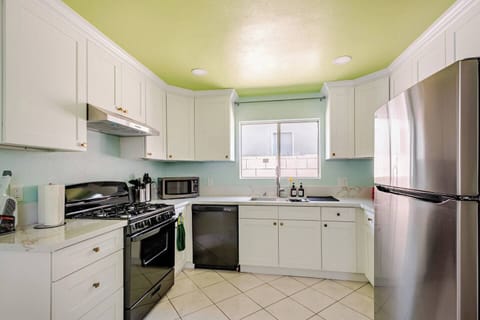 Fully stocked kitchen with modern appliances, plenty of counter space, and everything you need for easy meal prep.
