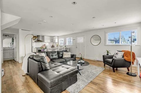 Living room features a leather couch that converts to a pull-out bed. 4K art frame TV with cable/netflix/blu-ray/plex/chromecast. We upgraded the coffee table is a lift-top for working. The end-table behind the couch expands to a 4 seat dining table!