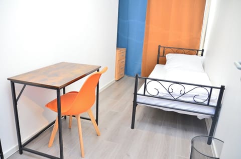 Desk, laptop workspace, blackout drapes, iron/ironing board