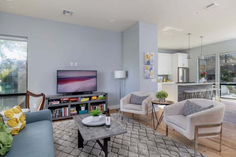 Modern Living space with TV and access to the back patio