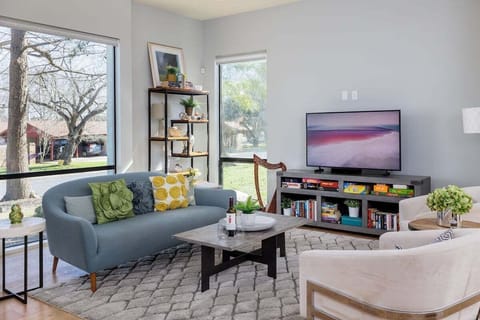 Modern Living space with TV and access to the back patio