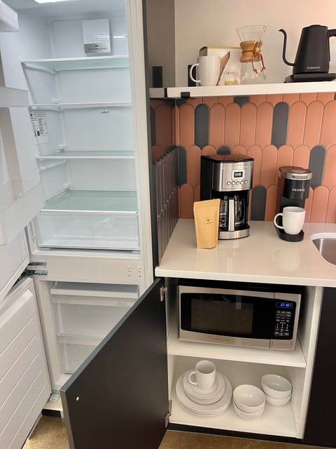 Large fridge and freezer, microwave, toaster, dishes, and all the coffee and tea gear!