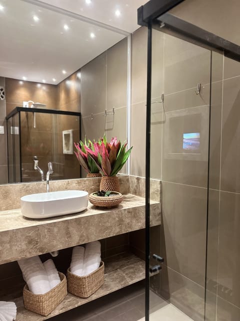 Seafront Premium Suite | Bathroom | Shower, hair dryer, towels