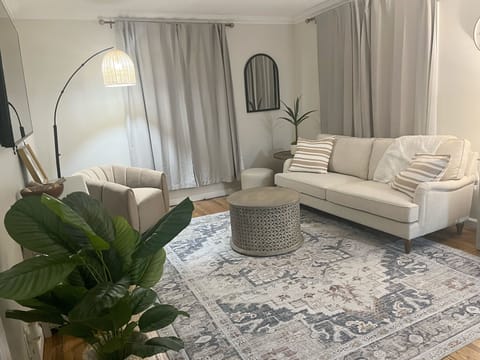 Overstuffed chair and sofa, 72" TV