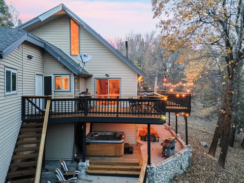 Spacious forest-view deck with firepit and outdoor dining — your private mountain retreat among the trees.