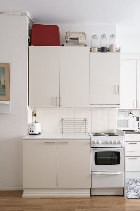 Kitchen equipped with a toaster for quick and convenient breakfasts.
