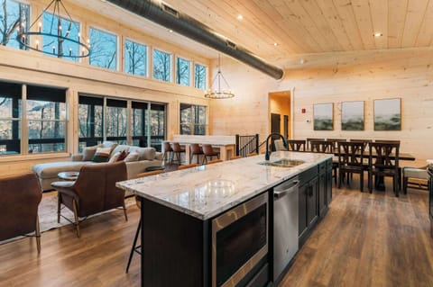 Kitchen and dining has seating for everyone! Plus two dining tables outside for those that enjoy dining al fresco!