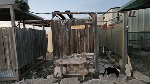 Entrance to outdoor privy and shower