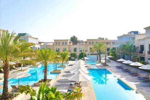 Outdoor pool, open 8:00 AM to 7:00 PM, pool umbrellas, sun loungers