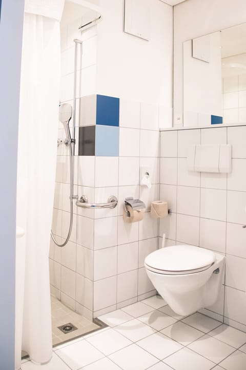 Shower, free toiletries, hair dryer, slippers