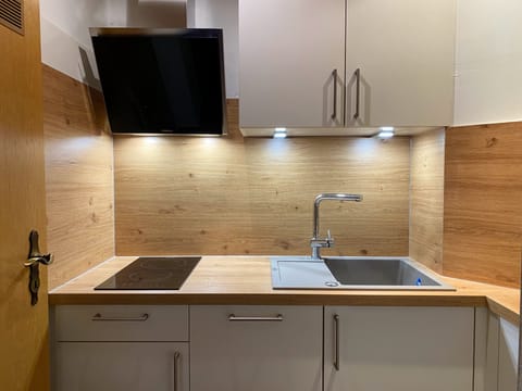 Shower, hair dryer, slippers, towels