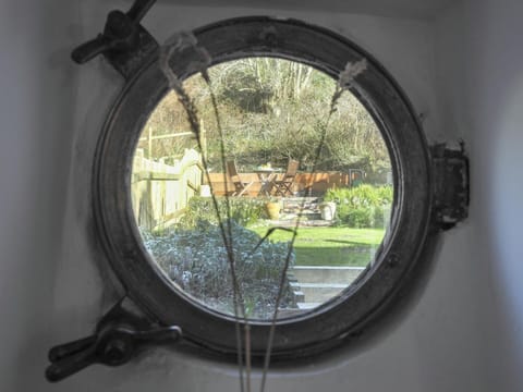 Port hole window to garden
