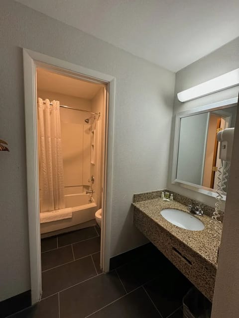 Separate tub and shower, hair dryer, towels, soap