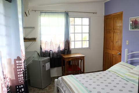 Quadruple Room, Garden View | Minibar, desk, blackout drapes, free WiFi