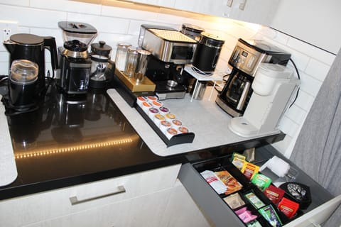 Coffee/tea station w/espresso, Keurig, drip, etc. Coffee & tea included.