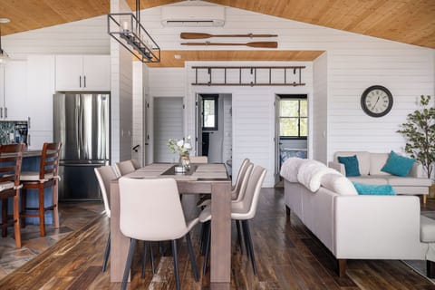 Stairs to downstairs on left, queen bed left, bathroom middle, king bed right