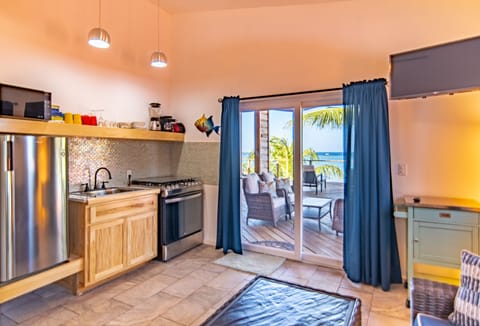 Premium Condo, 1 Bedroom, Kitchen, Beach View | Private kitchen | Fridge, microwave, oven, stovetop