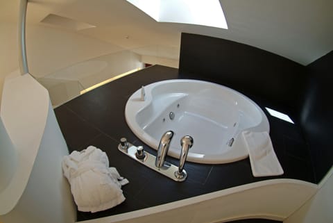 Suite, Jetted Tub (Duplex) | Bathroom | Deep soaking tub, free toiletries, hair dryer, towels