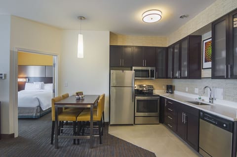 Suite, 2 Bedrooms | Private kitchen | Fridge, microwave, stovetop, dishwasher