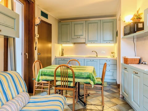 Furniture, Interior Design, Flooring, Wood, Floor, Ceiling, Countertop, Kitchen, Room, Cabinetry