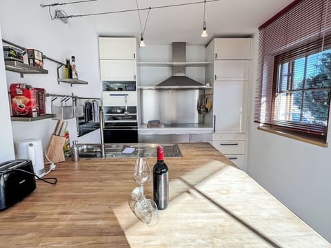 Flooring, Furniture, Kitchen, Interior Design, Wood, Kitchen Appliance, Countertop, Floor, Major Appliance, Ceiling