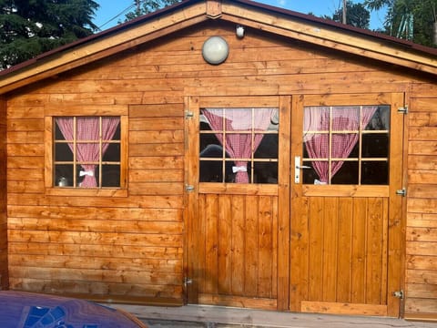 Front view of the rustic wooden guesthouse