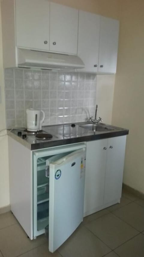 Apartment, Pool View | Private kitchen | Fridge, stovetop, coffee/tea maker, electric kettle