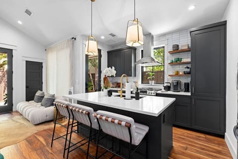 Stylish kitchen island that’s perfect for cooking, dining, and gathering around.