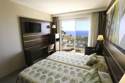 Triple Room, Pool View | Premium bedding, minibar, in-room safe, desk