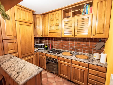 Kitchen, Cabinetry, Countertop, Kitchen Appliance, Flooring, Major Appliance, Wood, Interior Design, Floor, Furniture